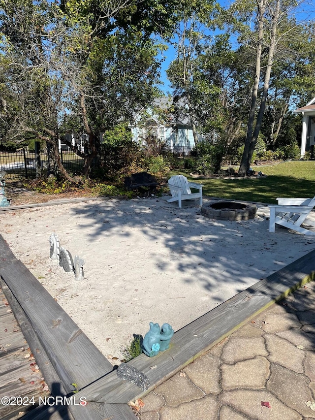 exterior space featuring an outdoor fire pit