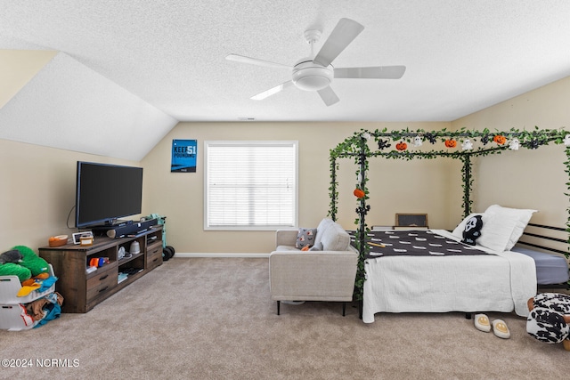 carpeted bedroom with a textured ceiling, lofted ceiling, and ceiling fan