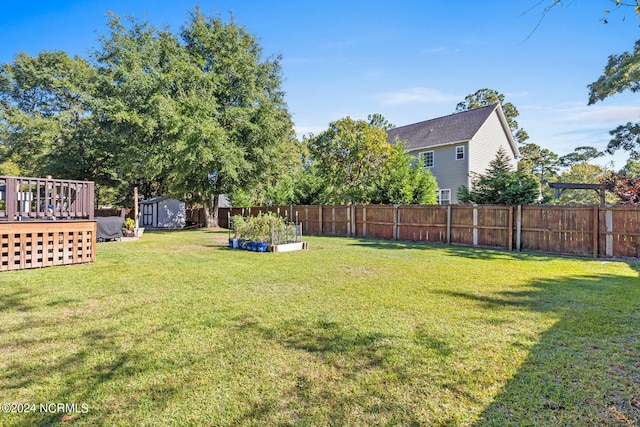 view of yard featuring a wooden deck