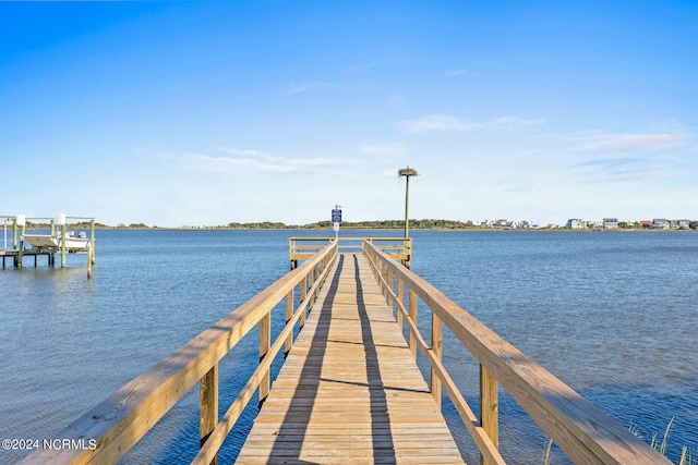 dock area featuring a water view