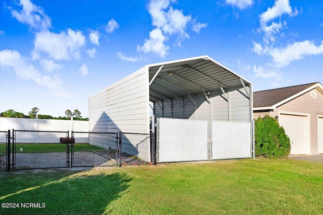 view of outdoor structure with a lawn and a carport