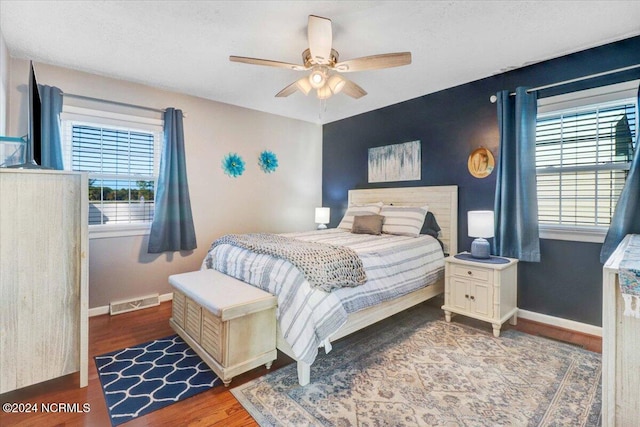 bedroom featuring hardwood / wood-style flooring and ceiling fan