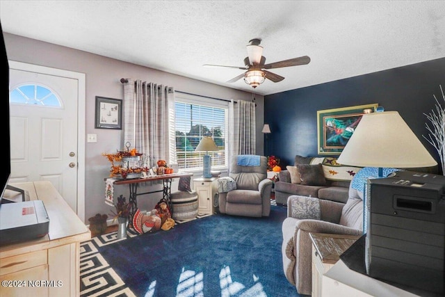 carpeted living room featuring a textured ceiling and ceiling fan