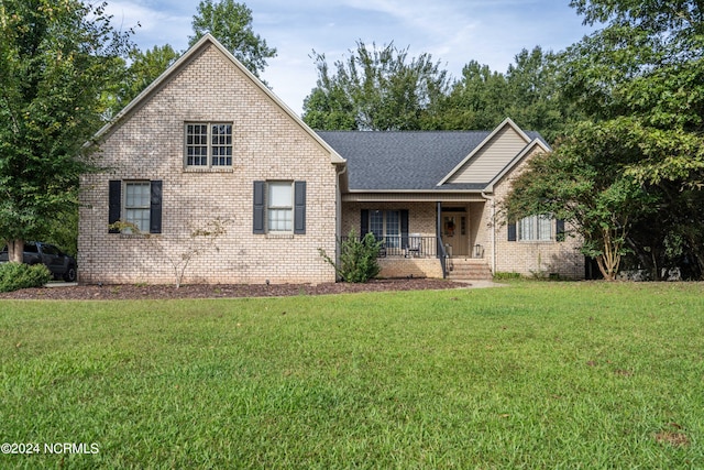 front of property featuring a porch and a front yard