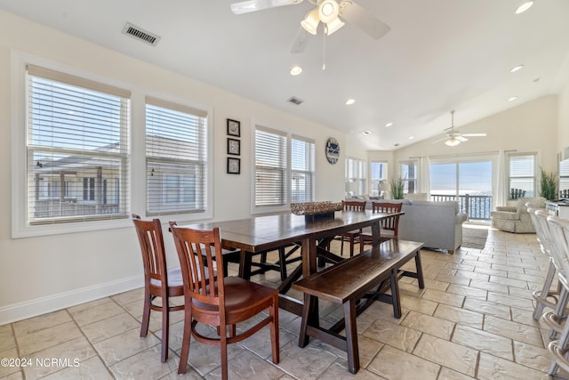 dining area featuring ceiling fan and vaulted ceiling