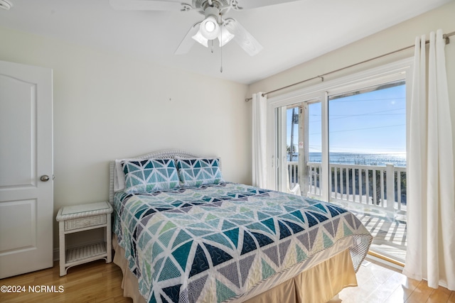 bedroom with hardwood / wood-style flooring, ceiling fan, and access to exterior