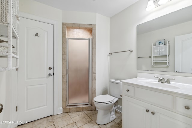 bathroom with vanity, toilet, and an enclosed shower