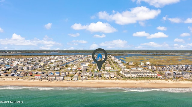 bird's eye view with a water view and a view of the beach