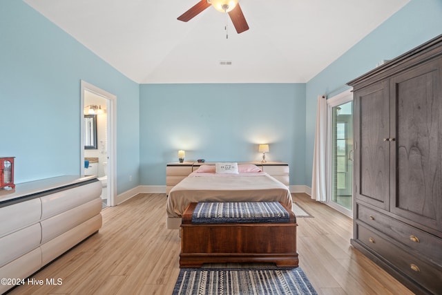 bedroom with lofted ceiling, ensuite bath, light wood-type flooring, and ceiling fan