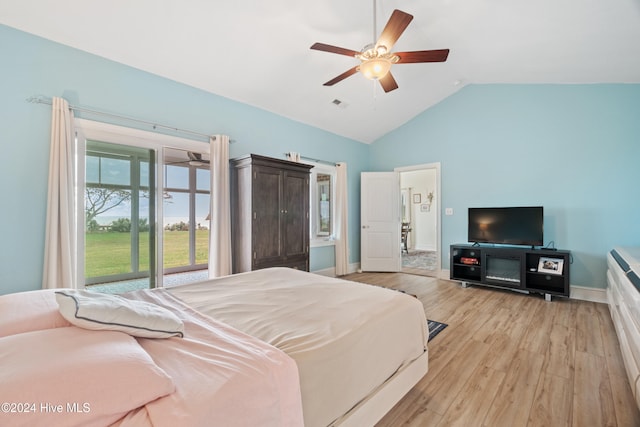 bedroom with vaulted ceiling, light wood-type flooring, and ceiling fan