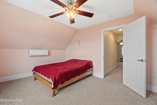 carpeted bedroom featuring ceiling fan, vaulted ceiling, and a wall mounted air conditioner