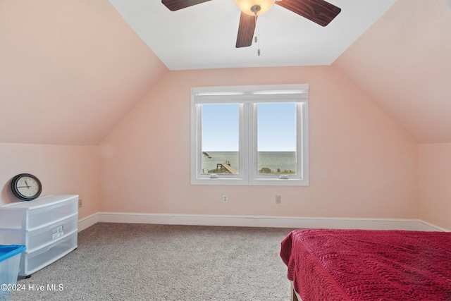 bedroom with ceiling fan, carpet flooring, and vaulted ceiling