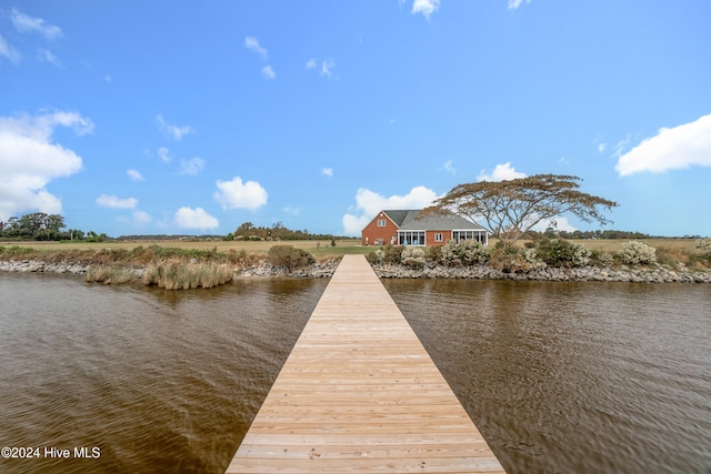 dock area with a water view