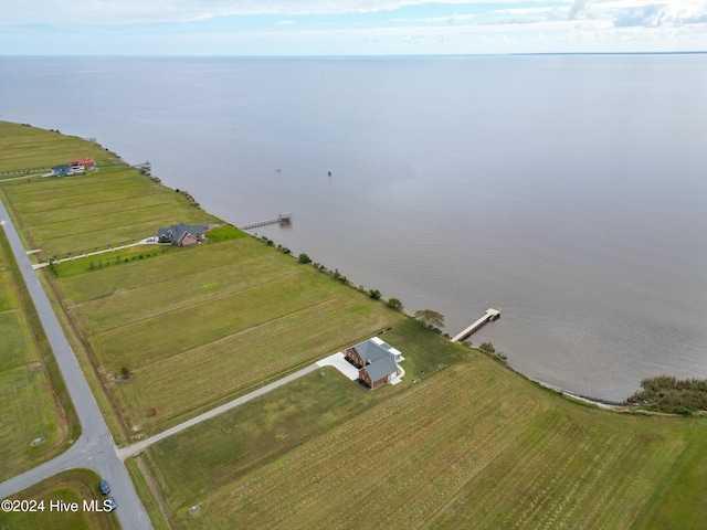 drone / aerial view featuring a water view and a rural view