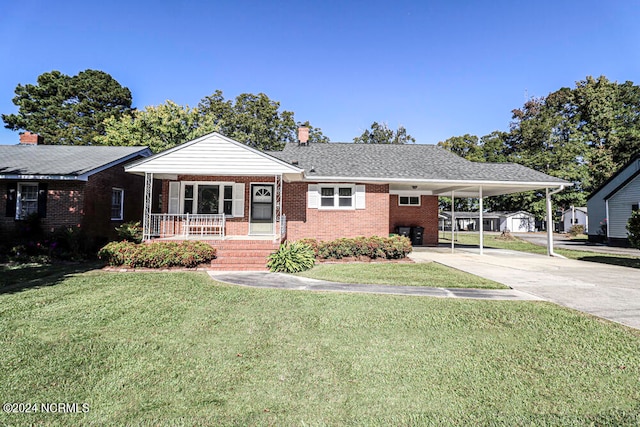 view of front of house with a carport, a front lawn, and a porch