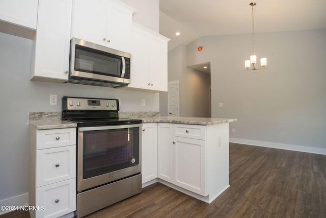 kitchen featuring white cabinets, stainless steel appliances, dark wood-type flooring, and vaulted ceiling