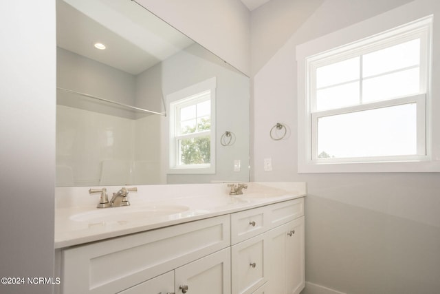 bathroom featuring vanity and walk in shower