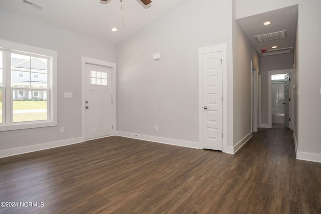 entrance foyer featuring dark wood-type flooring, ceiling fan, and high vaulted ceiling