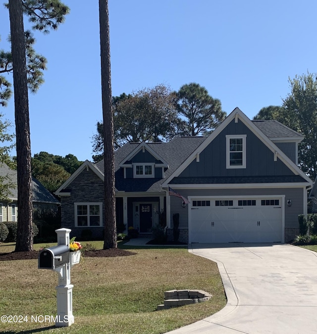 craftsman-style home featuring a front lawn and a garage