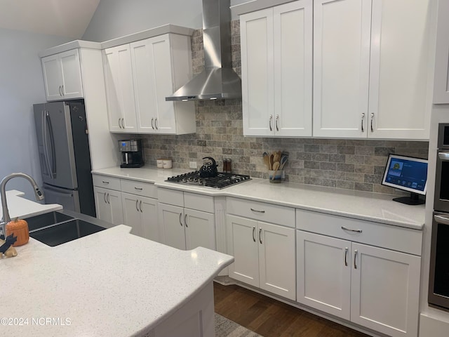 laundry room with sink, tile walls, and a wealth of natural light