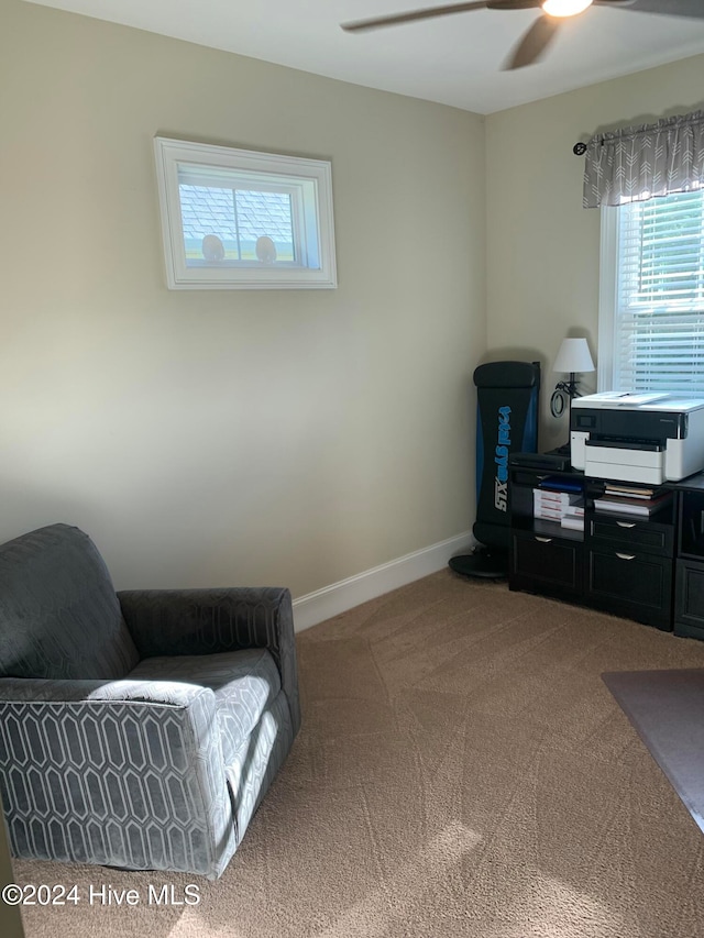 sitting room featuring carpet floors and ceiling fan