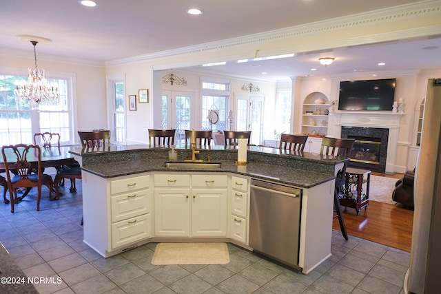 kitchen with crown molding, dishwasher, a kitchen bar, and pendant lighting