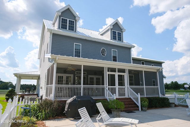 view of front of house featuring a sunroom, covered porch, and ceiling fan