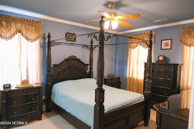 carpeted bedroom with crown molding and ceiling fan