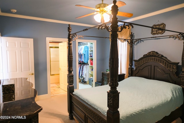 bedroom with ensuite bath, a closet, ceiling fan, crown molding, and carpet