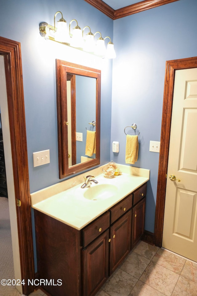 bathroom featuring vanity and ornamental molding