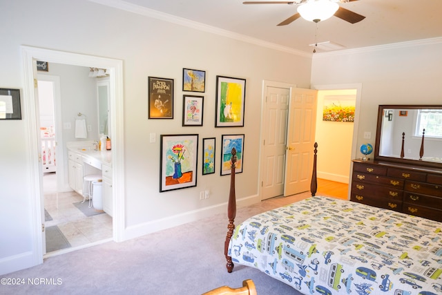 bedroom featuring crown molding, ensuite bathroom, light colored carpet, and ceiling fan