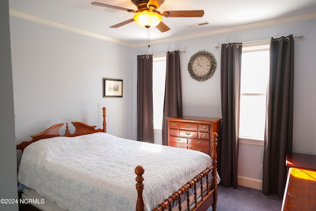 bedroom featuring ornamental molding, dark carpet, and ceiling fan