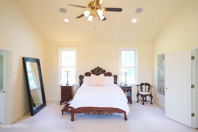 carpeted bedroom with ceiling fan, lofted ceiling, and multiple windows