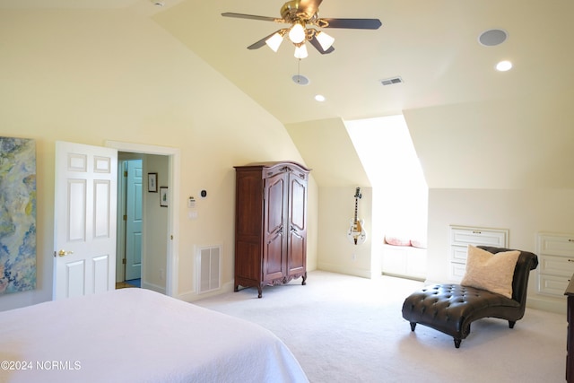 carpeted bedroom with ceiling fan and vaulted ceiling