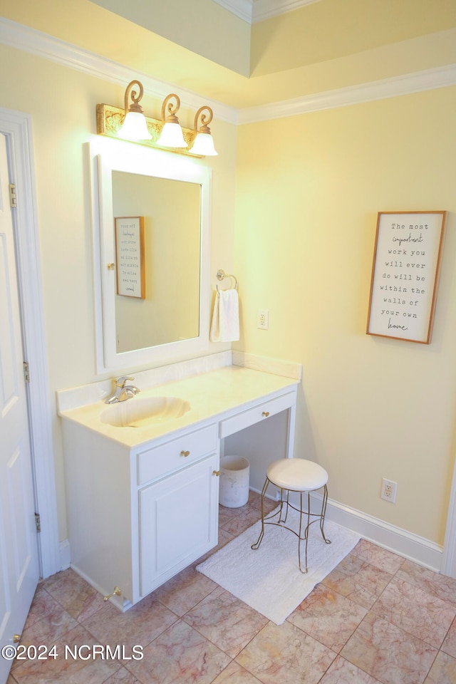 bathroom with vanity and ornamental molding