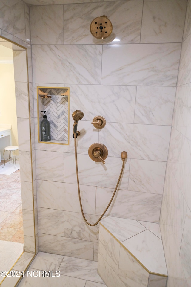 bathroom with a tile shower