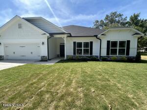 1491 Pecan Drive Model Home, Nashville, NC 27856 - ranch-style home with a garage, a front yard, and concrete driveway
