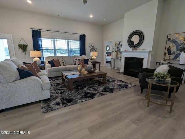 1491 Pecan Drive Model Home, Nashville, NC 27856 - living area featuring a fireplace with flush hearth, wood finished floors, recessed lighting, and visible vents