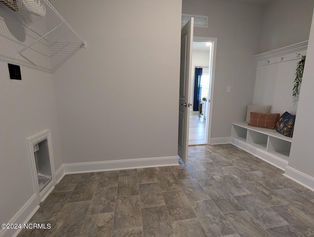 1491 Pecan Drive Model Home, Nashville, NC 27856 - laundry area with baseboards and stone finish floor