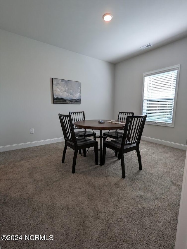 view of carpeted dining area