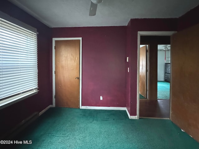 unfurnished bedroom with ceiling fan, carpet floors, and a closet