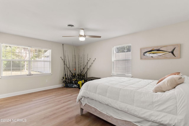 bedroom featuring light wood-type flooring and ceiling fan