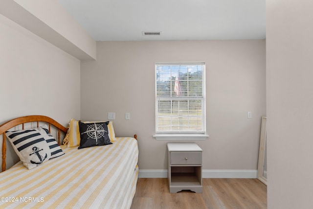 bedroom with light wood-type flooring