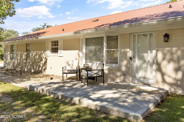 back of house with a patio area