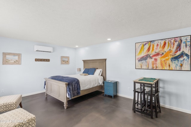 bedroom with a wall mounted AC and a textured ceiling