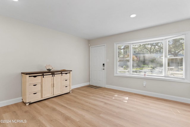 entrance foyer with light hardwood / wood-style floors