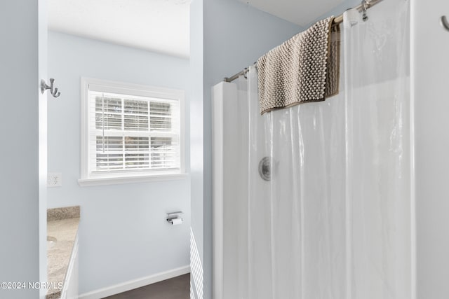 bathroom with vanity and walk in shower