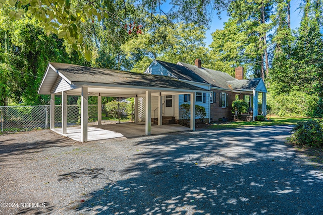 bungalow-style home with a carport