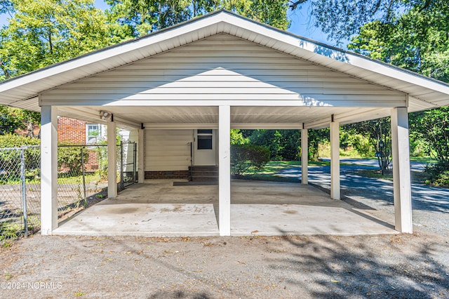 view of vehicle parking with a carport