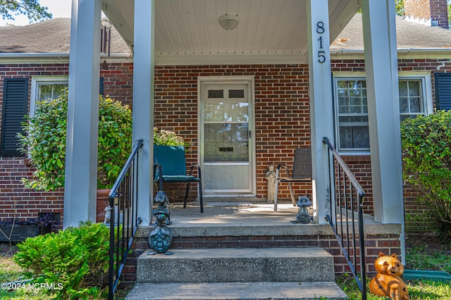 doorway to property with a porch